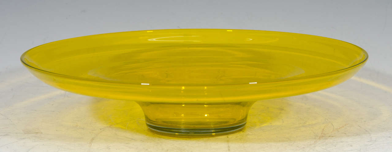 A vintage oversized yellow Blenko bowl. Marked "Blenko" on the bottom.

Good vintage condition with age appropriate wear. Some scratches.