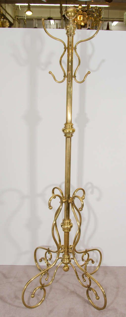 A 19th century large ornate Victorian brass coat rack with eight hooks.  Reduced from: $1,850