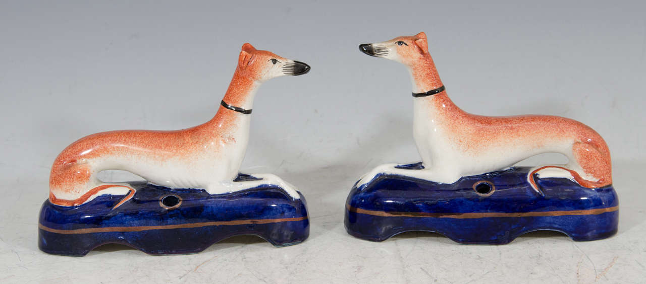 19th century pair of Staffordshire recumbent greyhound desk dogs or whippets with pen holder base. Stamped on the bottom. Comes with 2 brass pens. 

Item available here online, or at my showroom space in the Showplace Antique + Design Center, 3rd