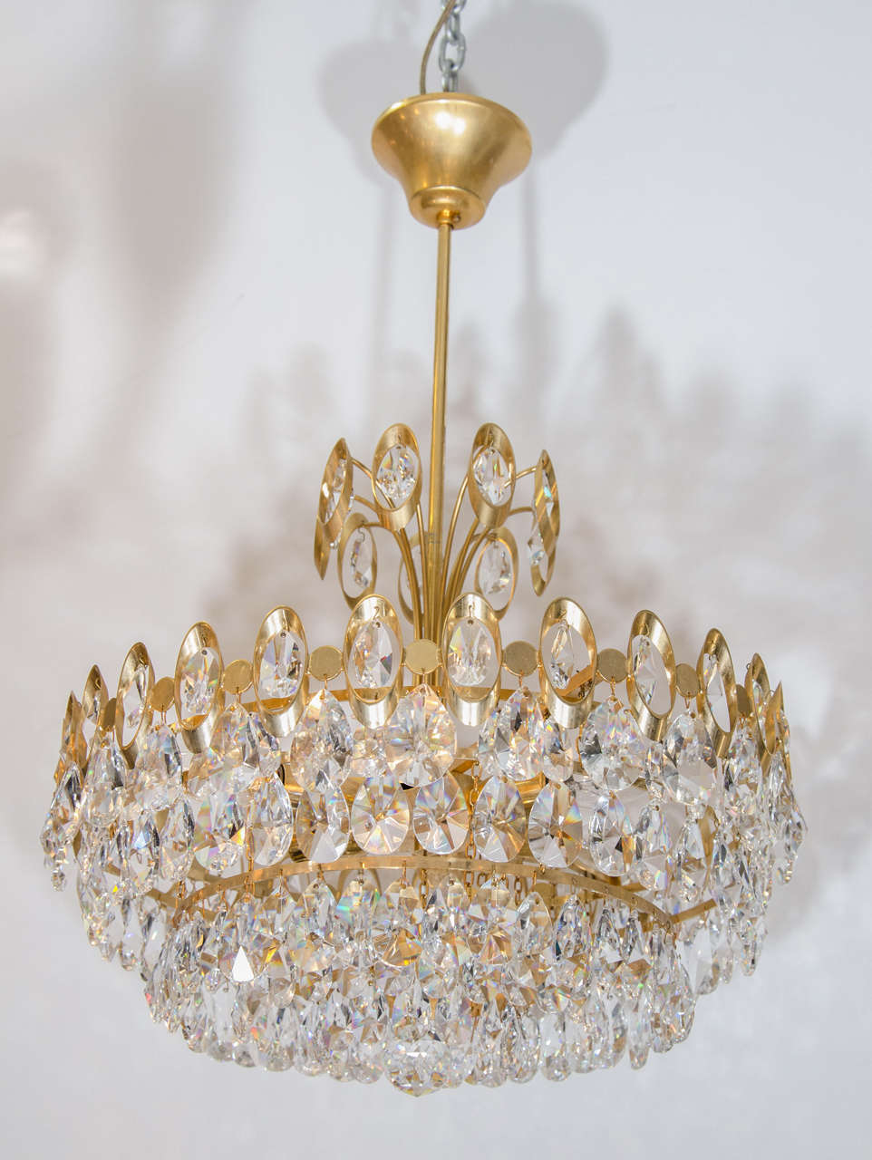 A vintage 1950s Italian chandelier in the style of Sciolari in brass, trimmed with Austrian crystals. Newly rewired.