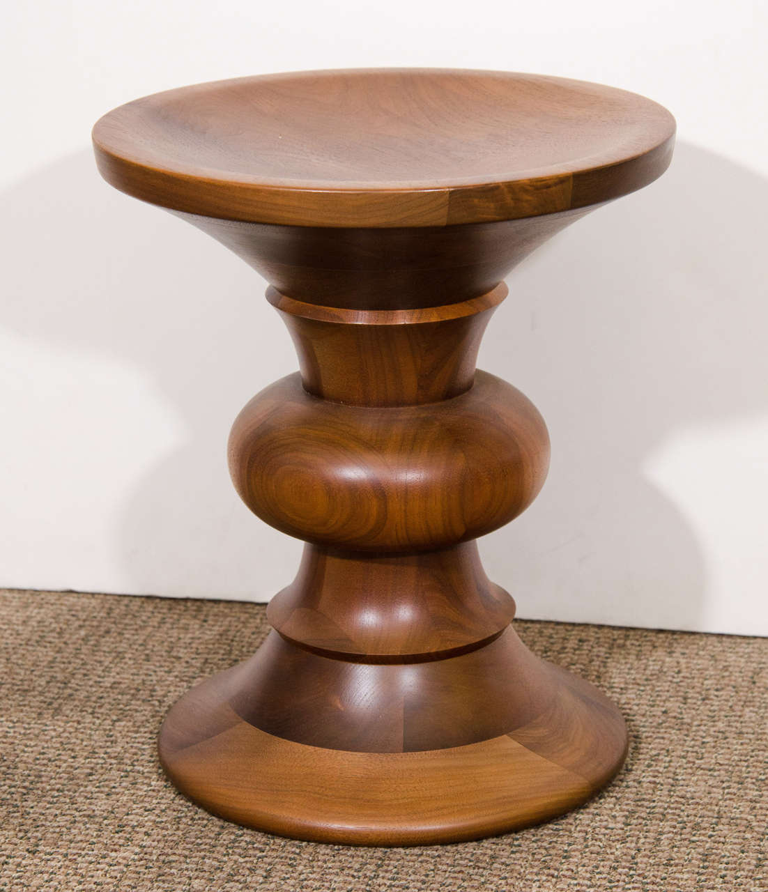 A vintage sculptural turned wood stool designed by Charles and Ray Eames for the Time-Life building in New York. Can also be used for a table.

Good vintage condition with age appropriate wear to seat area.