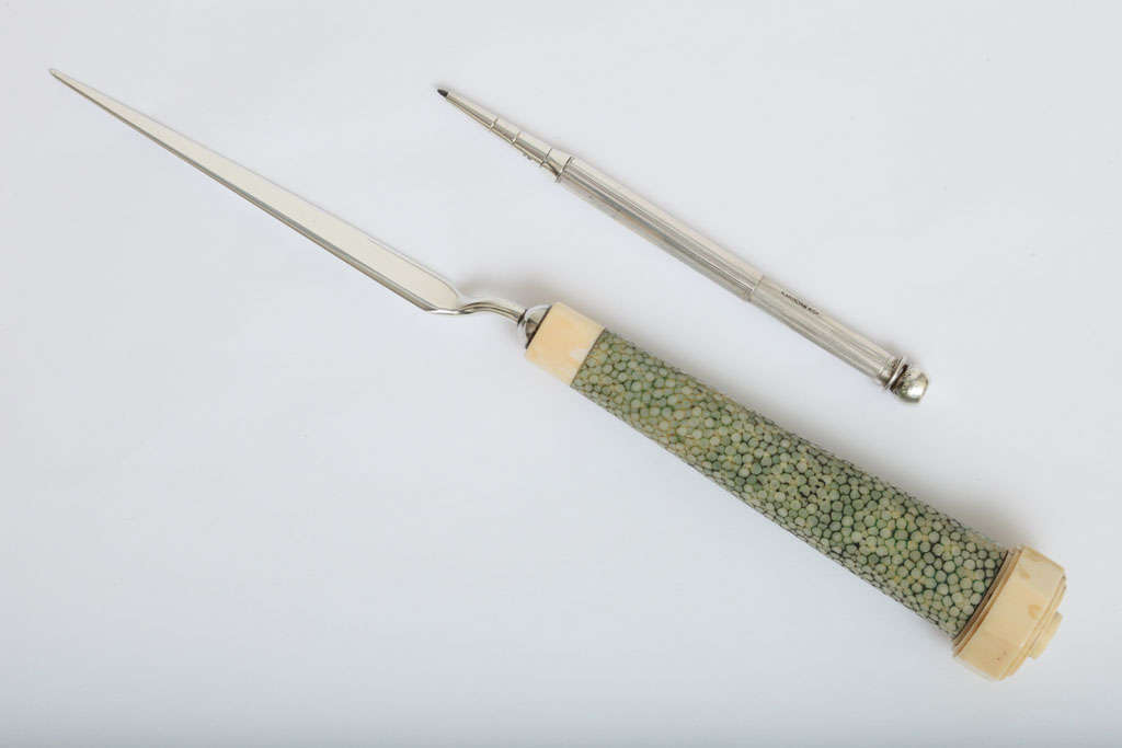 A rare and fantastic piece with exceptional attention to detail and workmanship. Sterling silver letter opener has a shagreen handle with carved ivory details. The interior of the handle is fitted with a sterling silver propelling pencil by Sampson