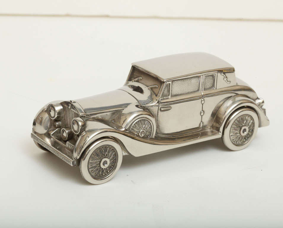 Silver plated Rolls-Royce money box (piggy bank). Featuring fully rotating wheels and a 