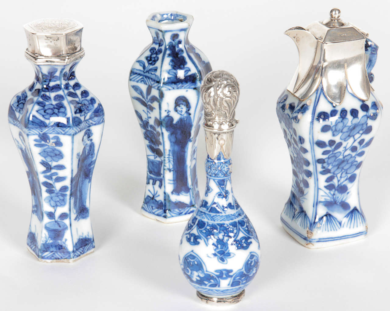Four miniature Chinese export vases some with Dutch silver
mountings Ca 1780
1   Octagonal shaped vase 4 inches tall - image 4

2  Octagonal shaped vase with silver top - image 3
     4.25 inches tall  small chip

3   Silver mounted vase with