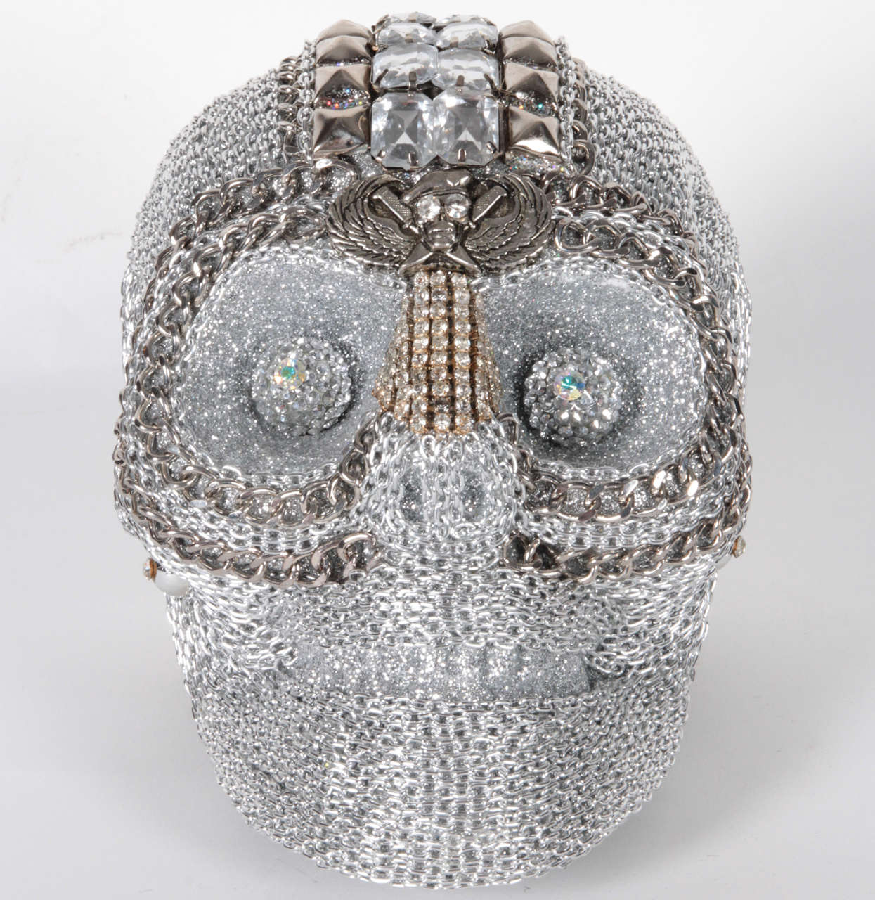 Fantastic and decorative  decorative skull encrusted with chain and vintage rhinestone jewelry findings by W Beaupre.