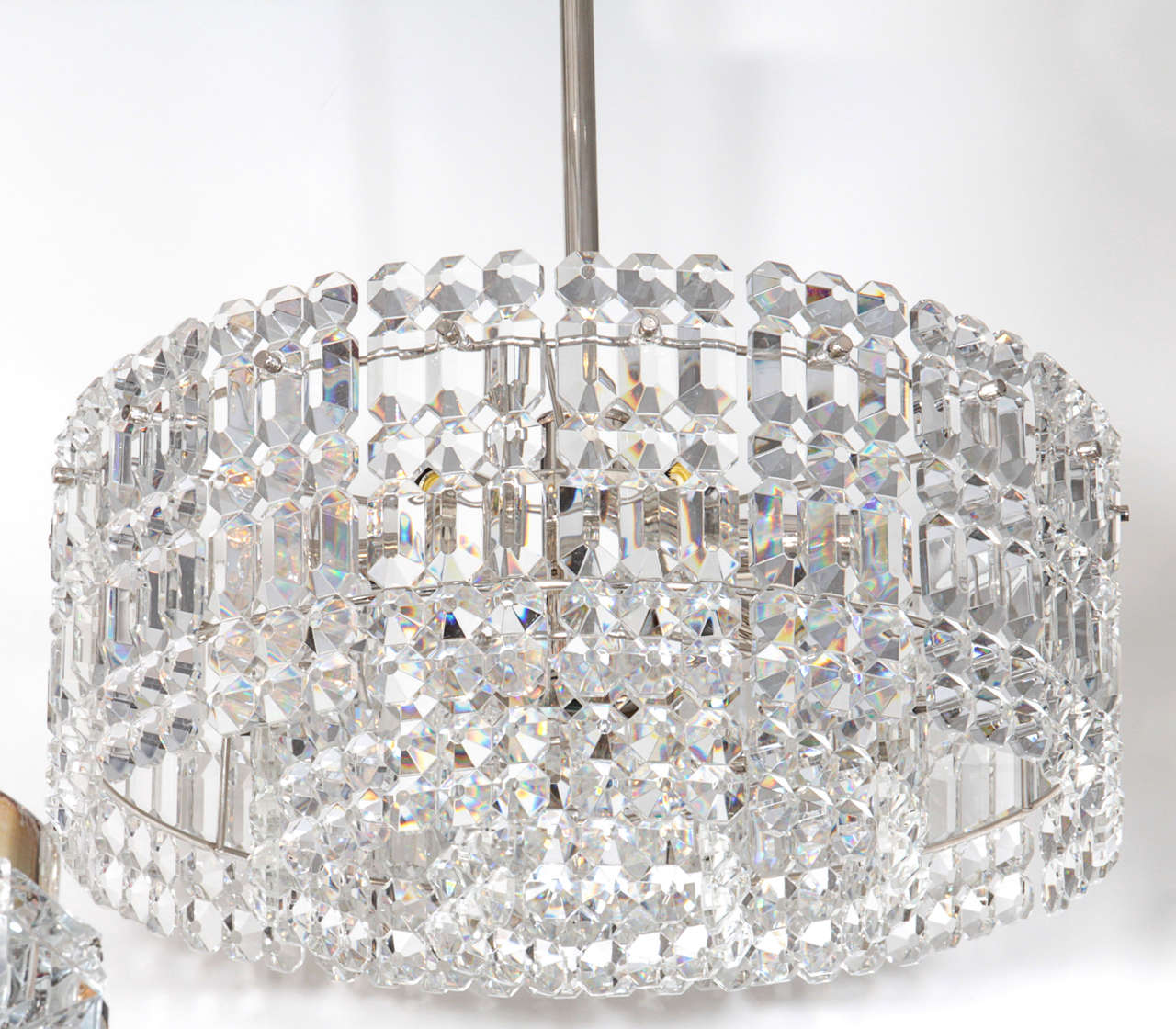 Dramatic drum chandelier composed of three layers of rectangular 
faceted crystal prisms on a polished nickel frame by Kinkeldey.

Crystal body measures 7.75 inches tall. 7 bulbs.