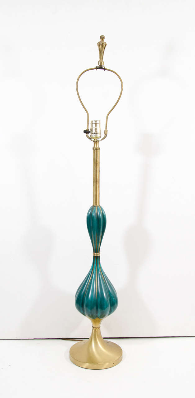 A pair of vintage table lamps in brass with turquoise blue enameled bodies and brass bases