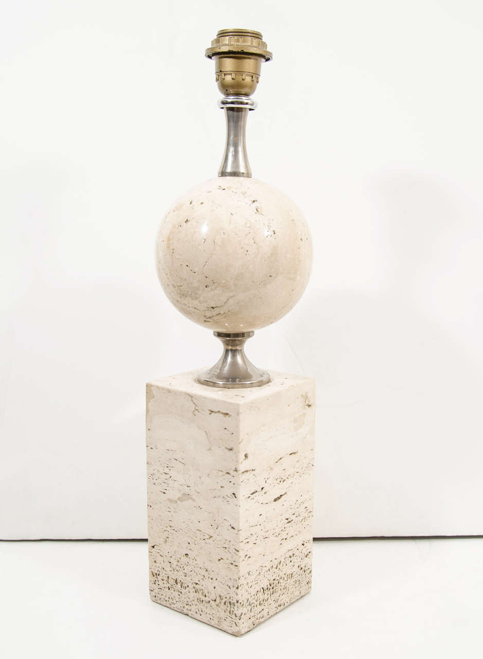 A vintage Maison Barbier travertine and brushed steel table lamp with globe shaped body on a pedestal base. Rewired for use in the US