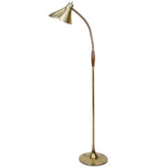 A Mid Century Brass Floor Lamp With Cone Form Shade