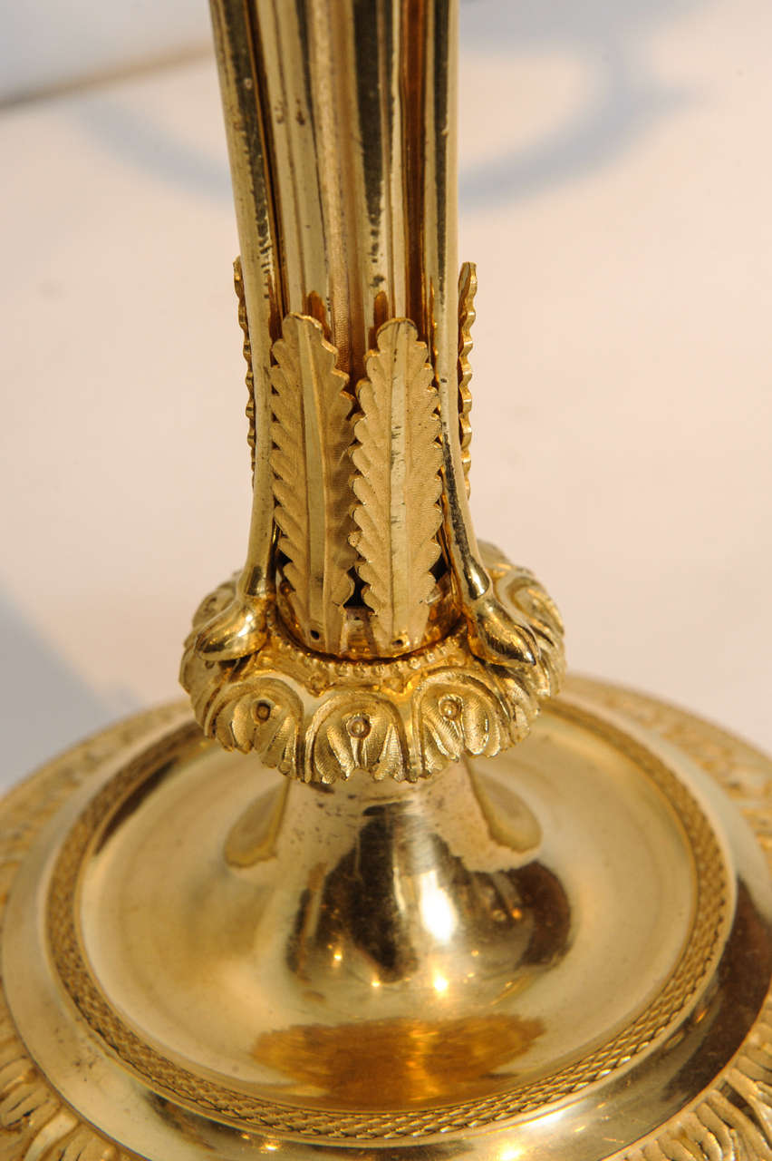 French A pair of Emire ormolu three-light candelabra, circa 1810