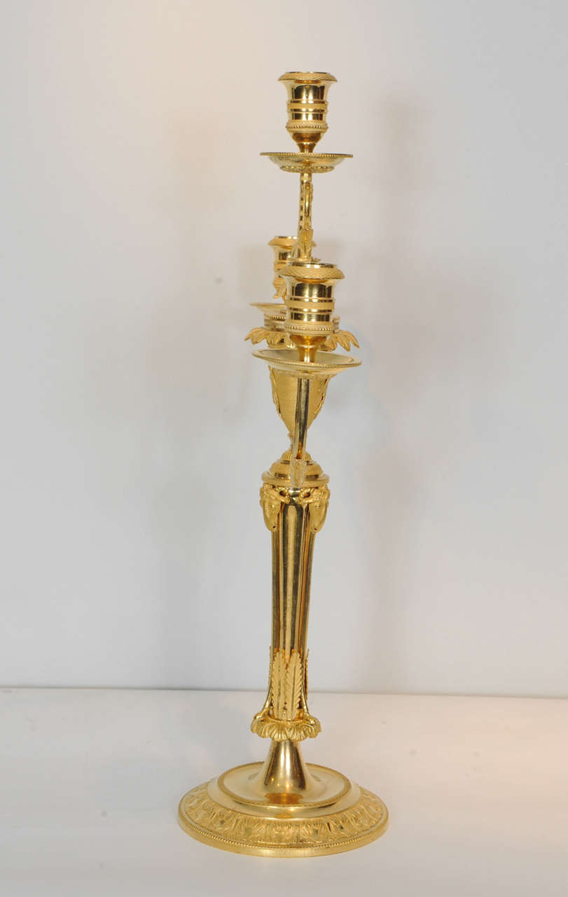 Ormolu A pair of Emire ormolu three-light candelabra, circa 1810