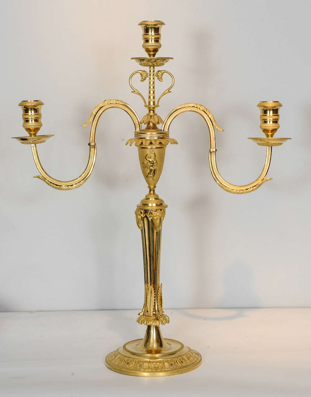 A pair of Emire ormolu three-light candelabra, circa 1810 1