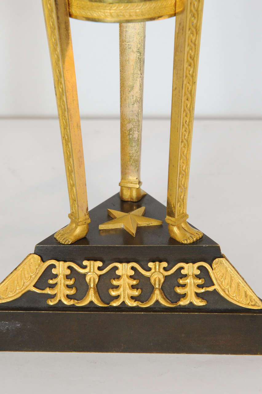 A pair of Empire ormolu and patinated bronze candlesticks, circa 1800 In Good Condition In Amsterdam, Noord Holland