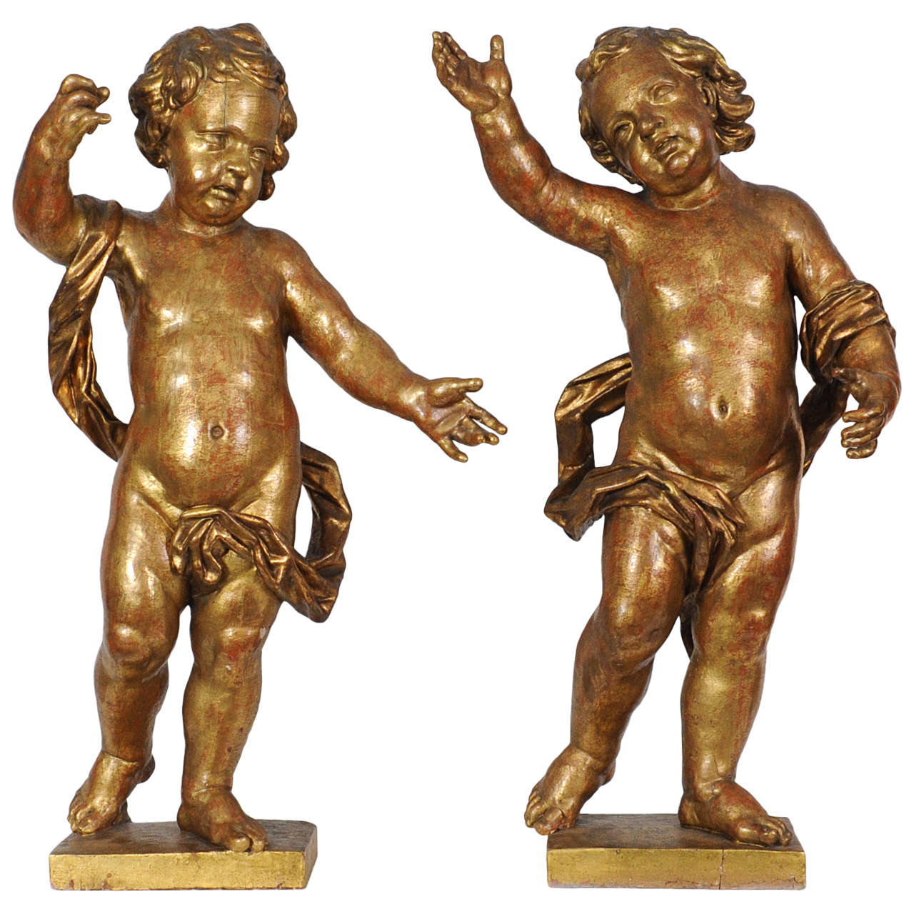 A pair of Dutch giltwood figures of putti, circa 1660 For Sale