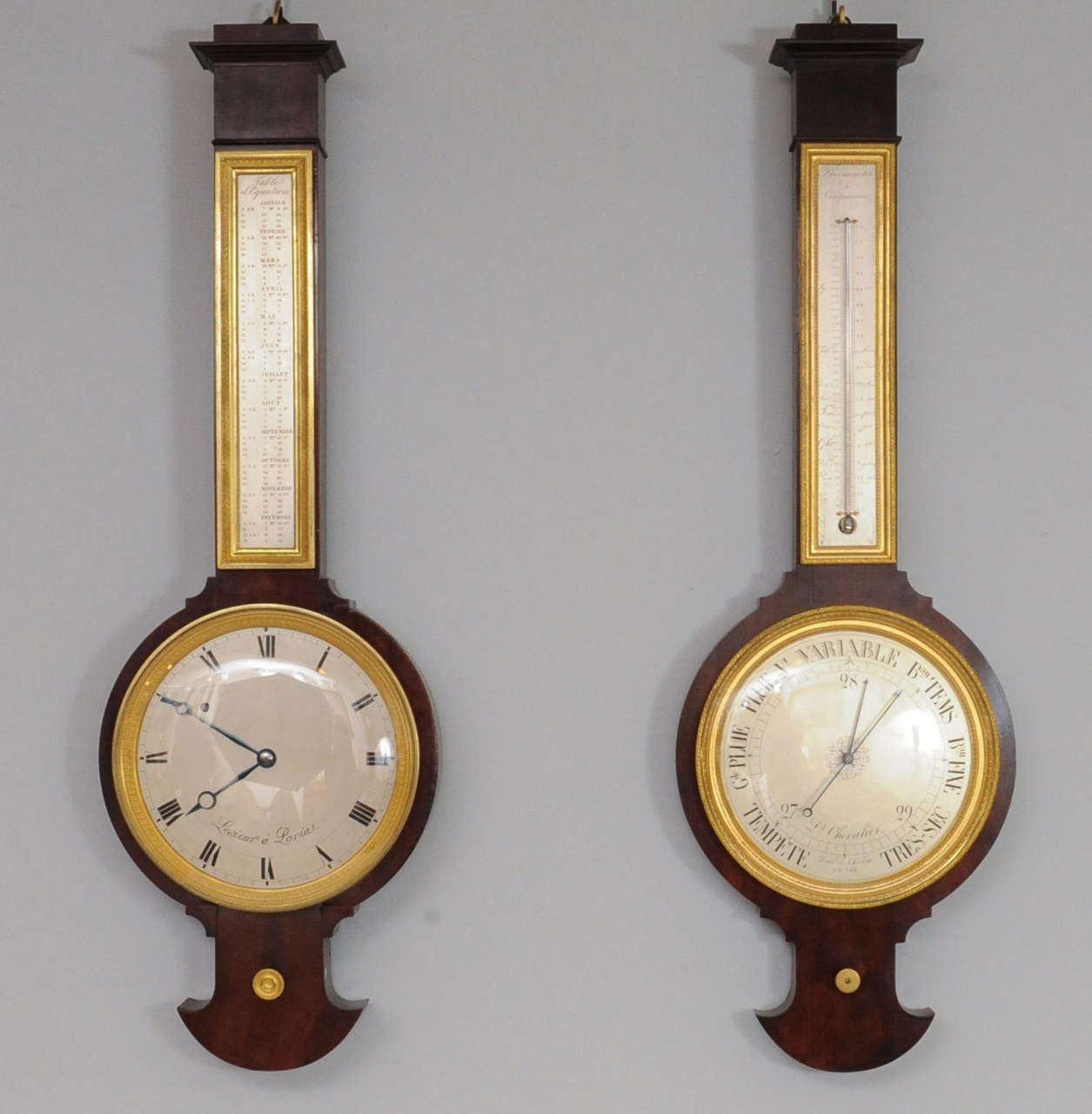 A near pair of pendant Empire mahogany wall clock and barometer, circa 1820