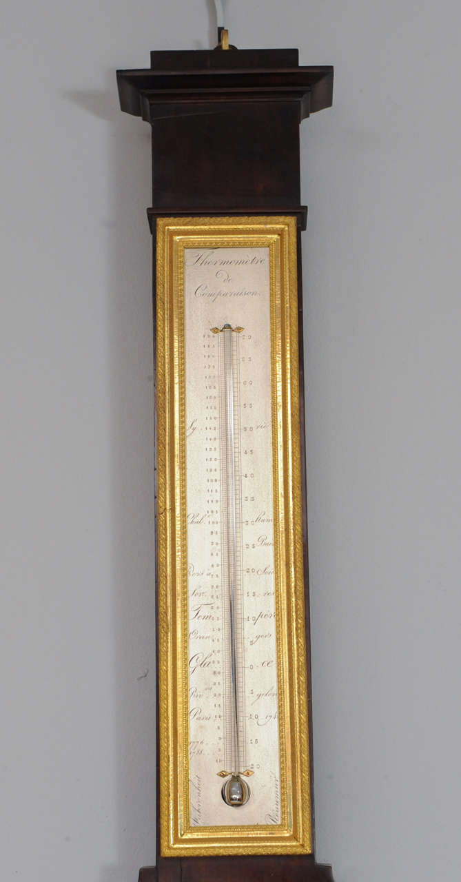 19th Century A near pair of pendant Empire mahogany wall clock and barometer, circa 1820 For Sale