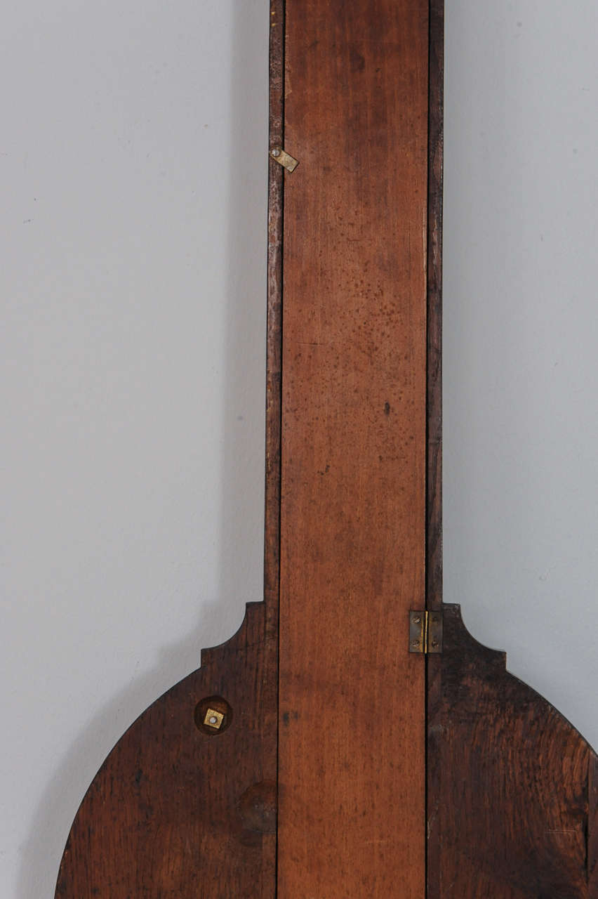 A near pair of pendant Empire mahogany wall clock and barometer, circa 1820 For Sale 3