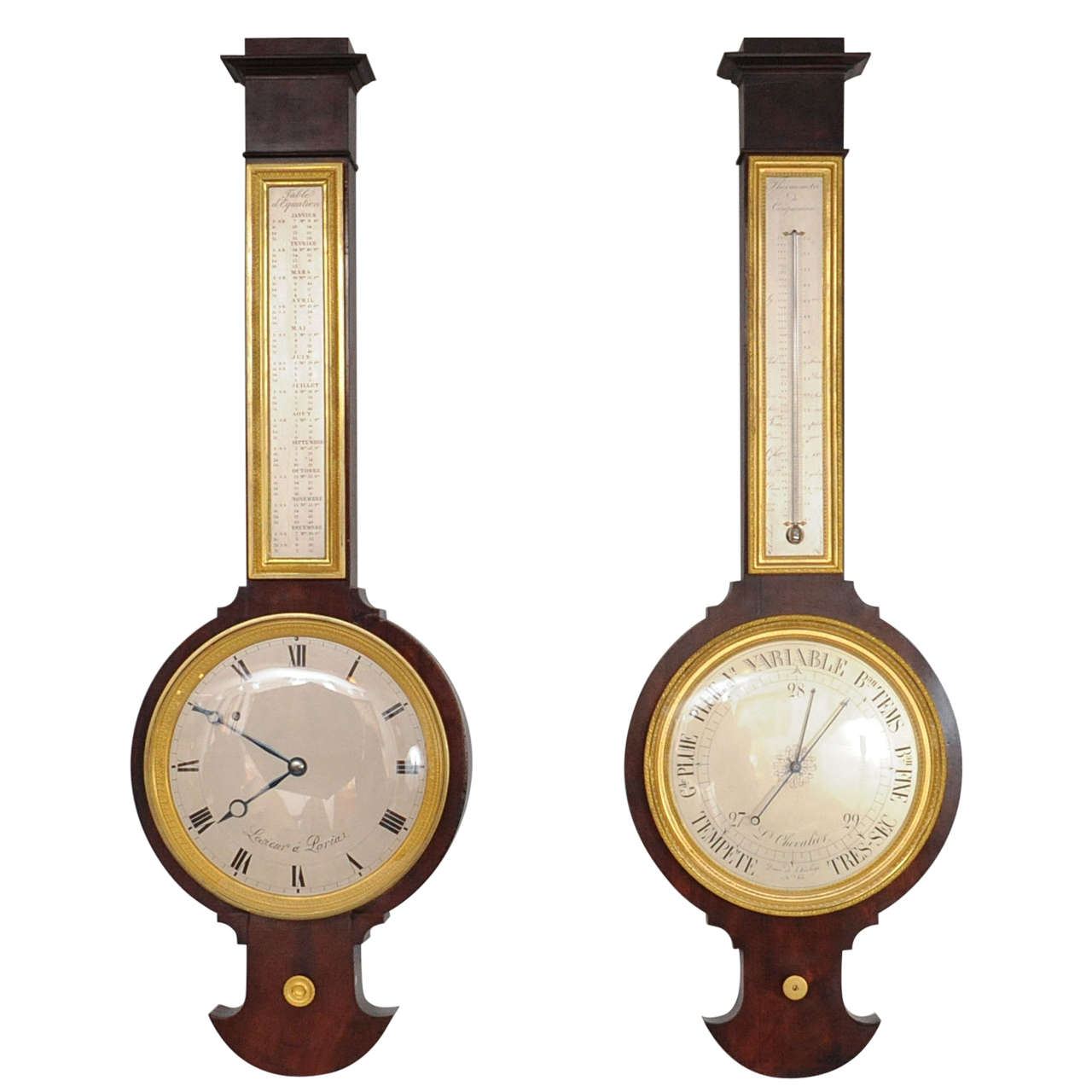 A near pair of pendant Empire mahogany wall clock and barometer, circa 1820 For Sale