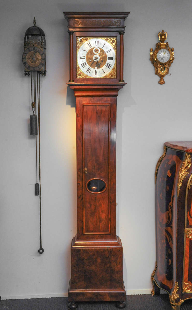 8-day duration, go and striking, with an 11-inch dial and alarm, in a walnut longcase, signed 'Baijgnoulx Amsterdam'. This clockmaker, born in Blois, France, came to Holland in 1689 as a refugee and settled in Amsterdam, where he worked under the
