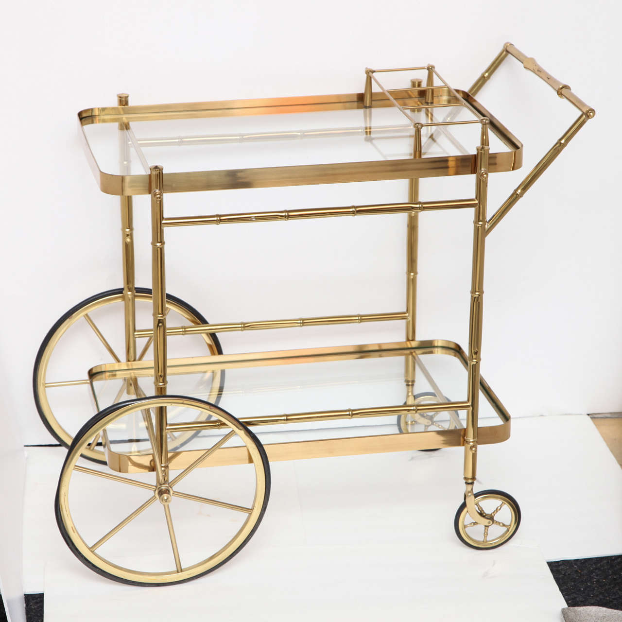 Decorative brass bar cart, circa 1960. 
The bar cart has now been polished and new rubber on the wheels.