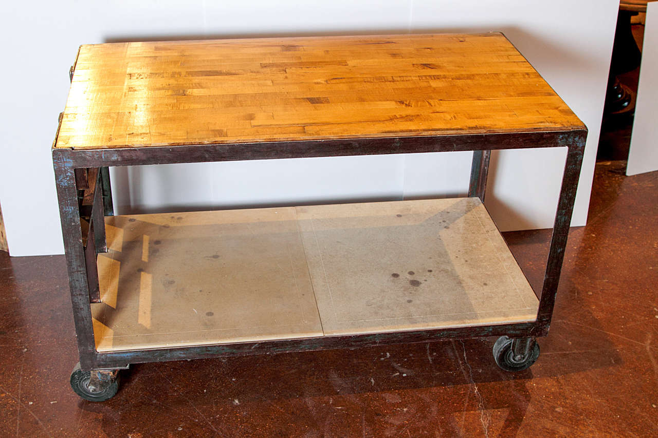 Vintage Shop Cart 
Unique 1940's Shop cart used as a server or design aesthetic appeal for interest
Antique butcher's block walnut wood used as top
2" thick Limestone distressed top as bottom shelf
With Cast Iron and wheels
Can be easily