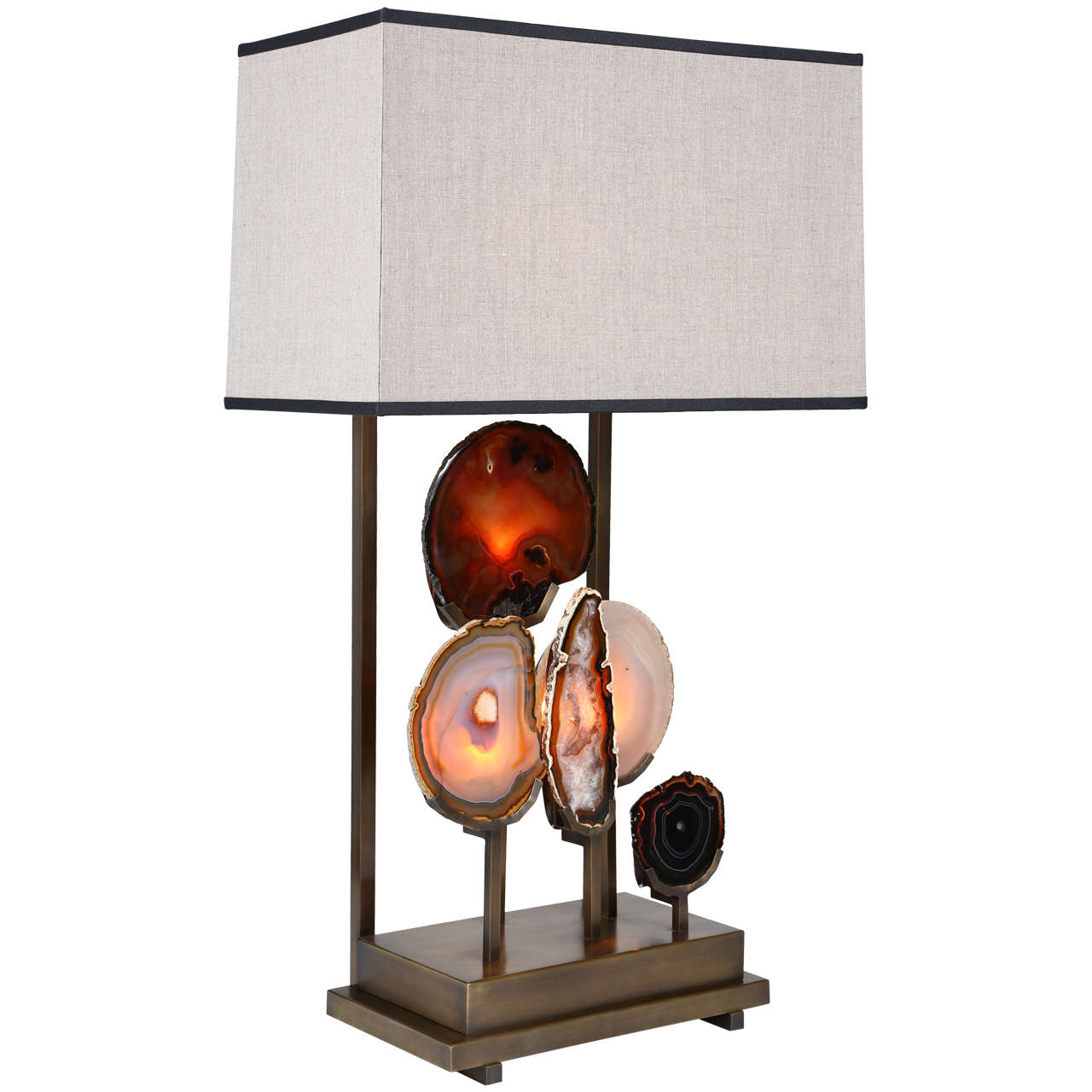 A stunning pair of custom-made “Pedra” table lamps by Patrick Dragonette for Dragonette Private Label, each featuring a quintet of beautiful agates mounted on a patinated brass base. The lamps are switched to illuminate the lampshade, agates or