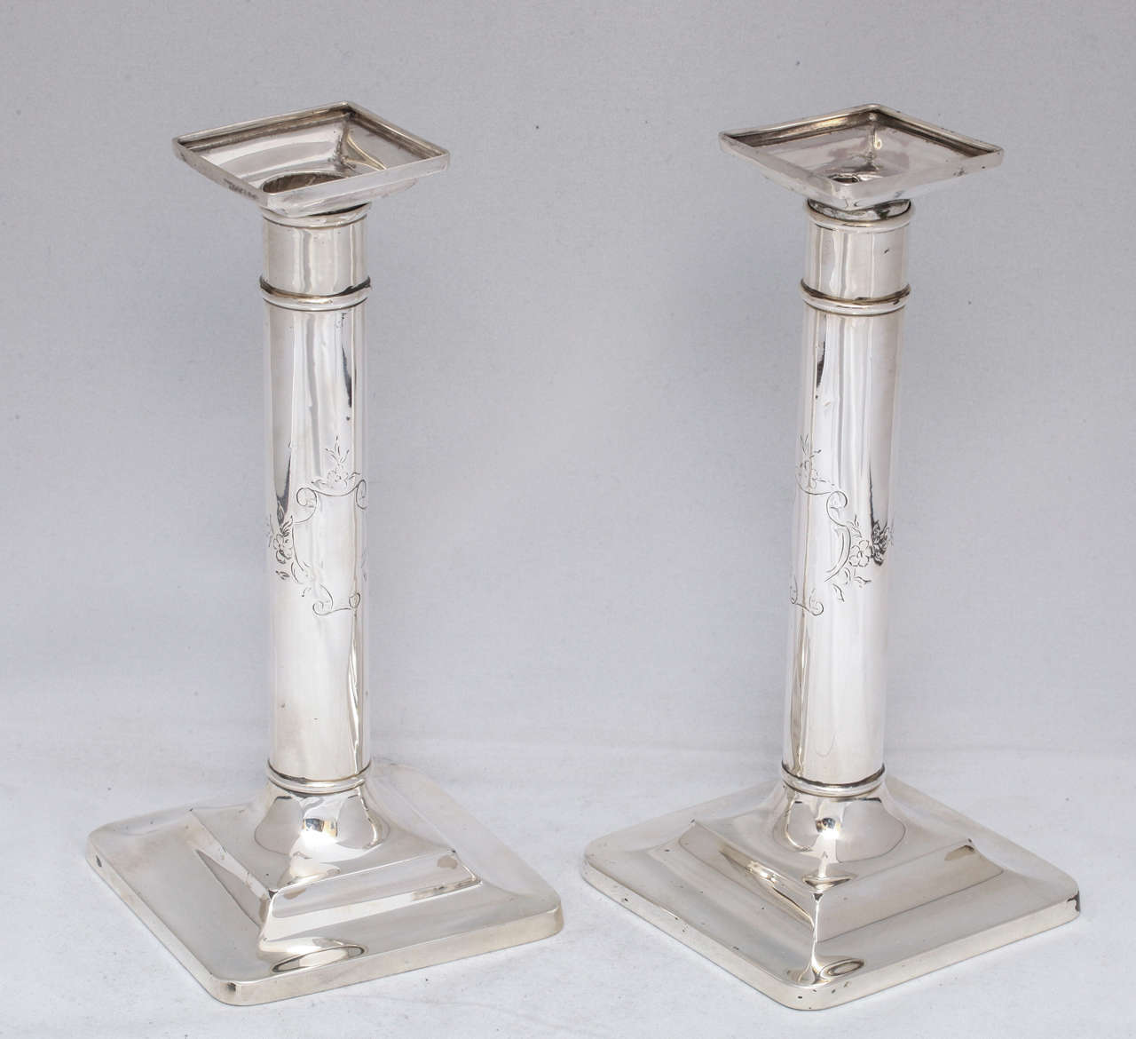 Lovely pair of sterling silver, column-form candlesticks with removable bobeches and vacant cartouches, Tiffany & Co, New York, year marked for 1903-1904. Measures: 8