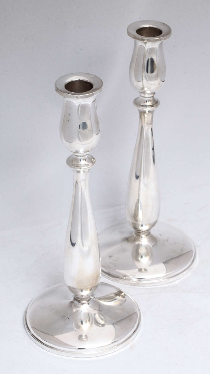 Lovely pair of sterling silver candlesticks, Cartier, New York, circa 1950s. Graceful form. Measures: @9 1/4