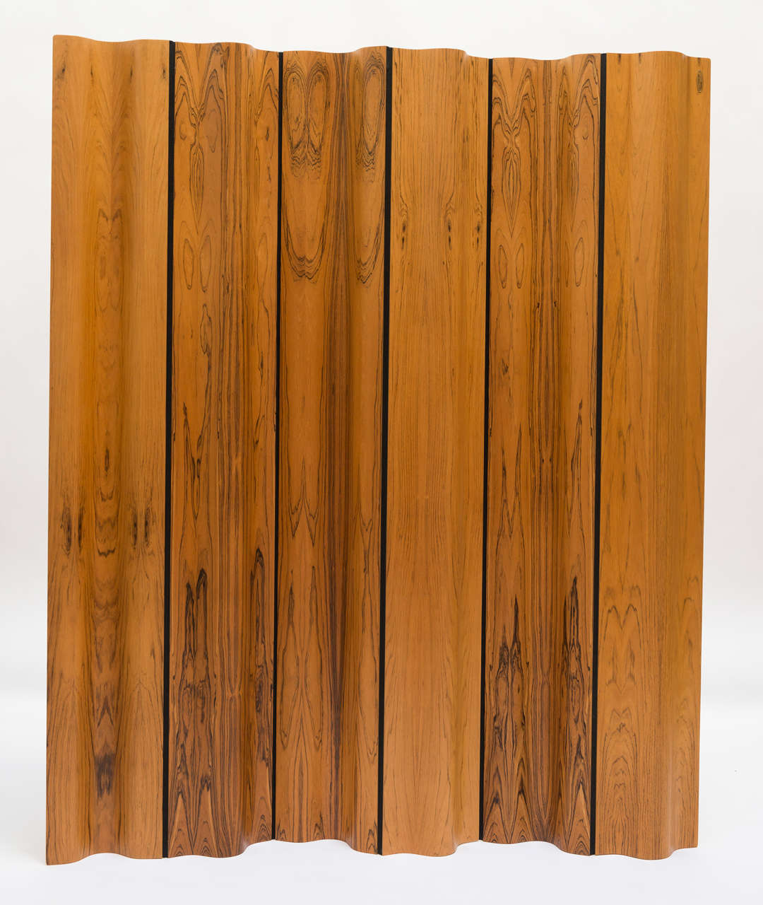 One-piece of the numbered edition of 500 rosewood screens by Charles Eames. No. 190 of 500.