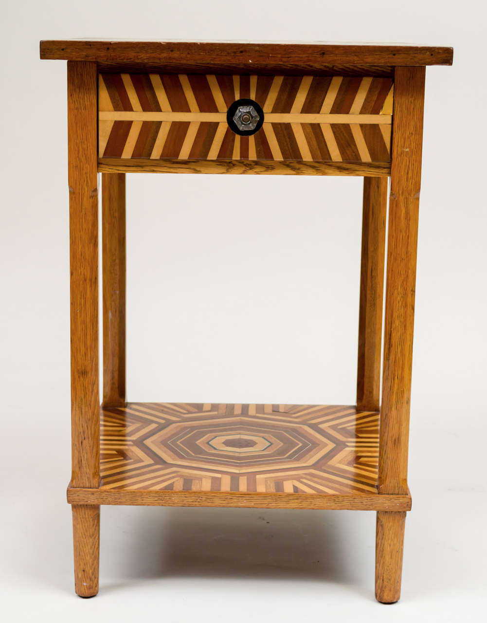 Early 20th c. American Folk Art marquetry side table. One drawer and a shelf stretcher base. Complex marquetry design on top and base. Circa 1920 - 30.