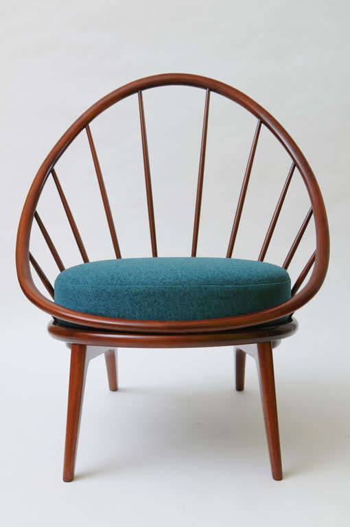 SOLD  An Ib Kofod Larsen classic design, this beautifully crafted Danish chair exhibits an organic shape in the curved lathe and hand turned bentwood back and spindle fan spray.  Exquisitely restored and reupholstered, the seat and back cushion in a