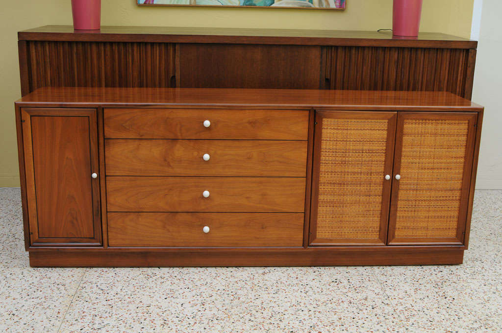 ...SOLD...  Designed for Drexel, this beautiful walnut cabinet credenza by Stewart MacDougall and Kip Stewart features drawers, and shelves behind doors in a sleek classic body highlighted by wonderfully figured walnut, ebony inlay stringing and