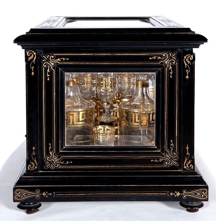 A Fine Ebony Tantalus Set