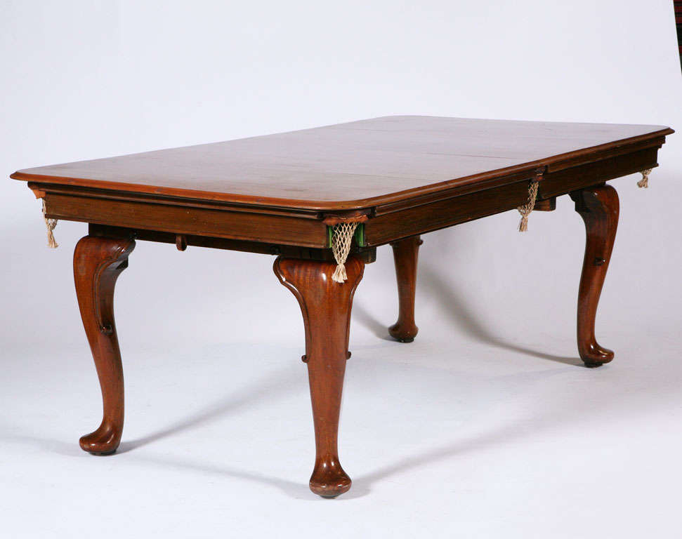 4 leaf top diner table dated 1920s. Queen Anne Style. Walnut and Mahogany. The legs have a rise and fall for playing then eating for height adjustment
made by the Billiard Table Builders W Jelks & Sons Ltd of 263/275 Holloway Road, London. Has all