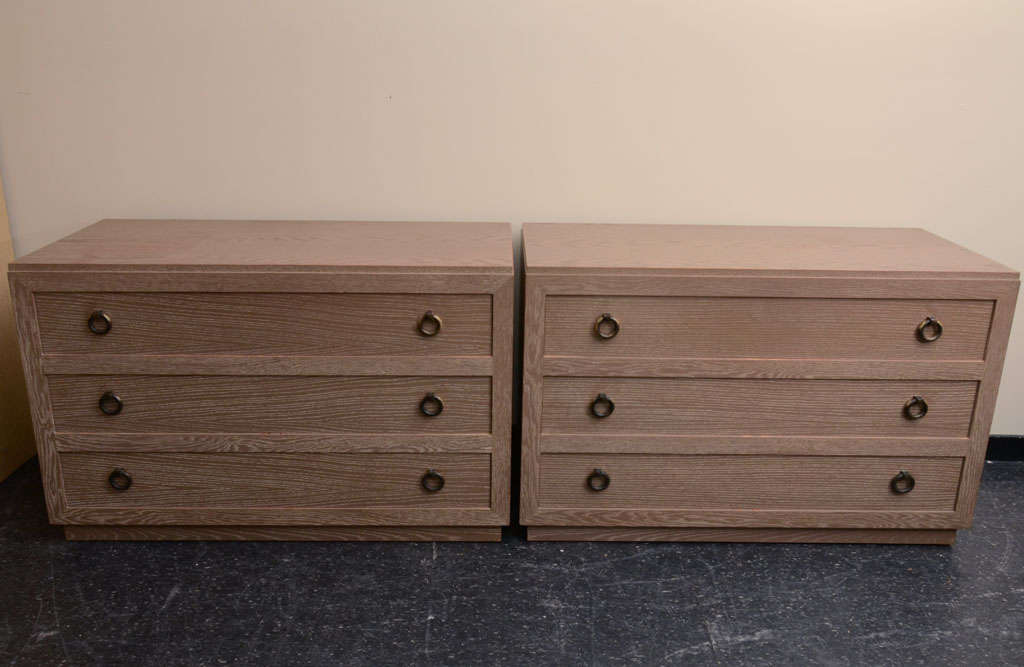 Wonderful large pair of oak cabinets by  James Mont. The cabinets are in there original cerused oak finish and have the round metal pulls