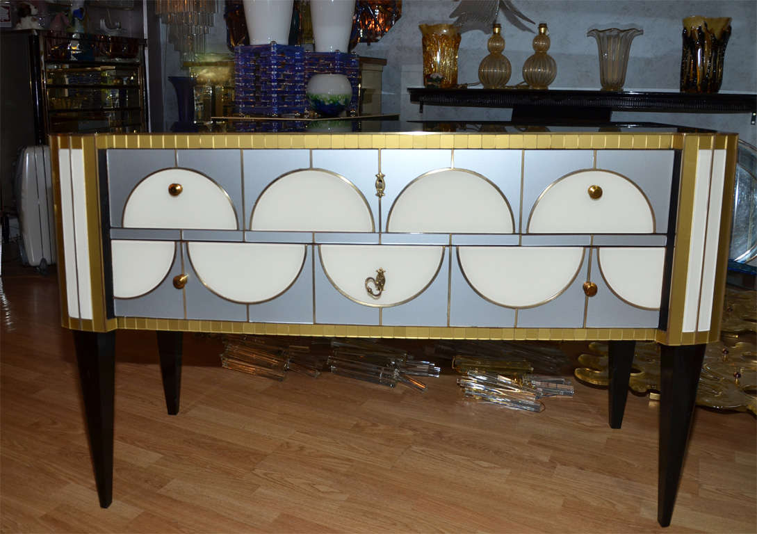 One commode all in mirror with two drawers.