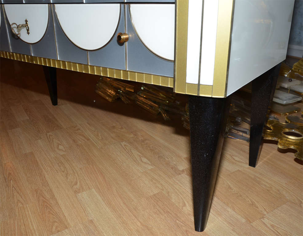 One commode all in mirror, with two drawers. 1
