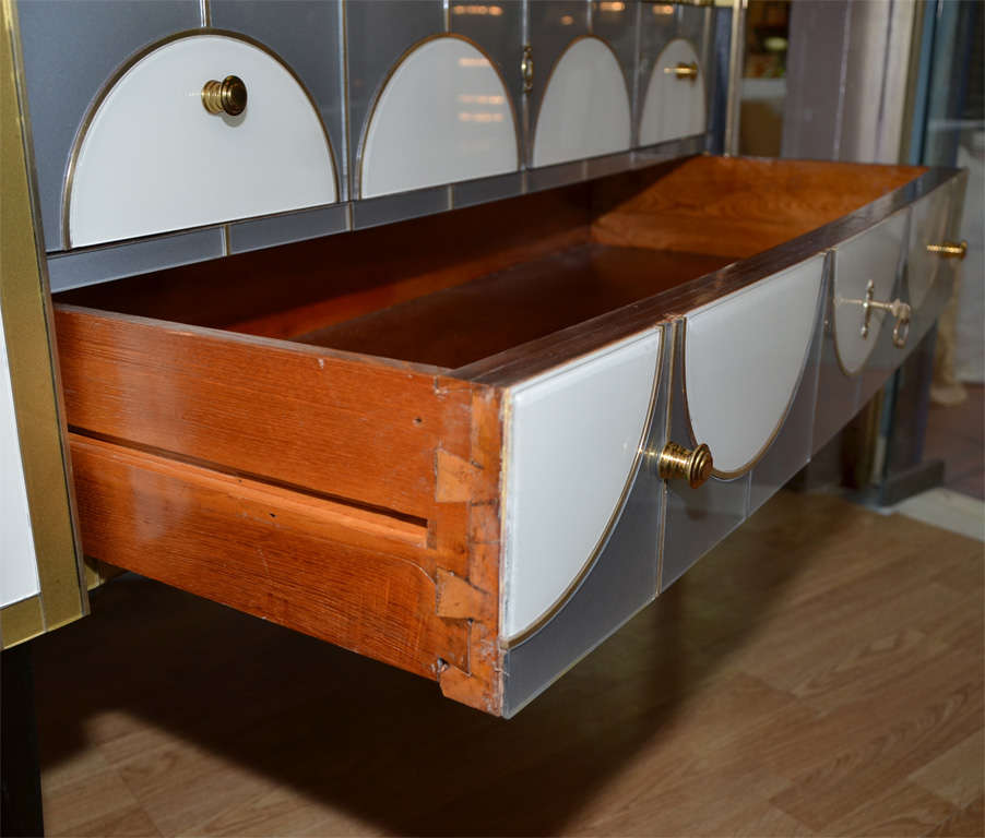 One commode all in mirror, with two drawers. 3