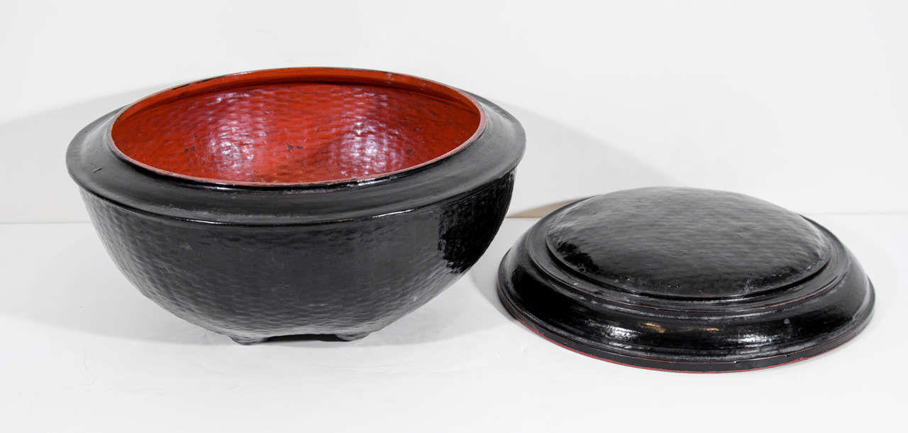A covered lacquer monastery food bowl used to transport food to monks in Burmese temple.  Burma, c.1920. 
L106
