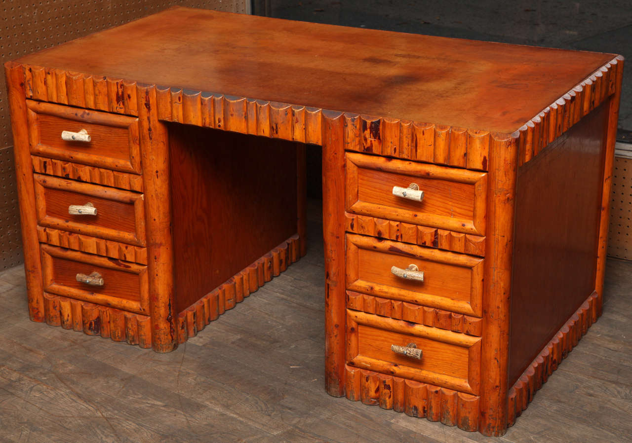 This desk was made by Thomas Molesworth furniture maker or in the style of Thomas Molesworth. This desk was either made by Thomas Molesworth himself or an apprentice at his workshop.