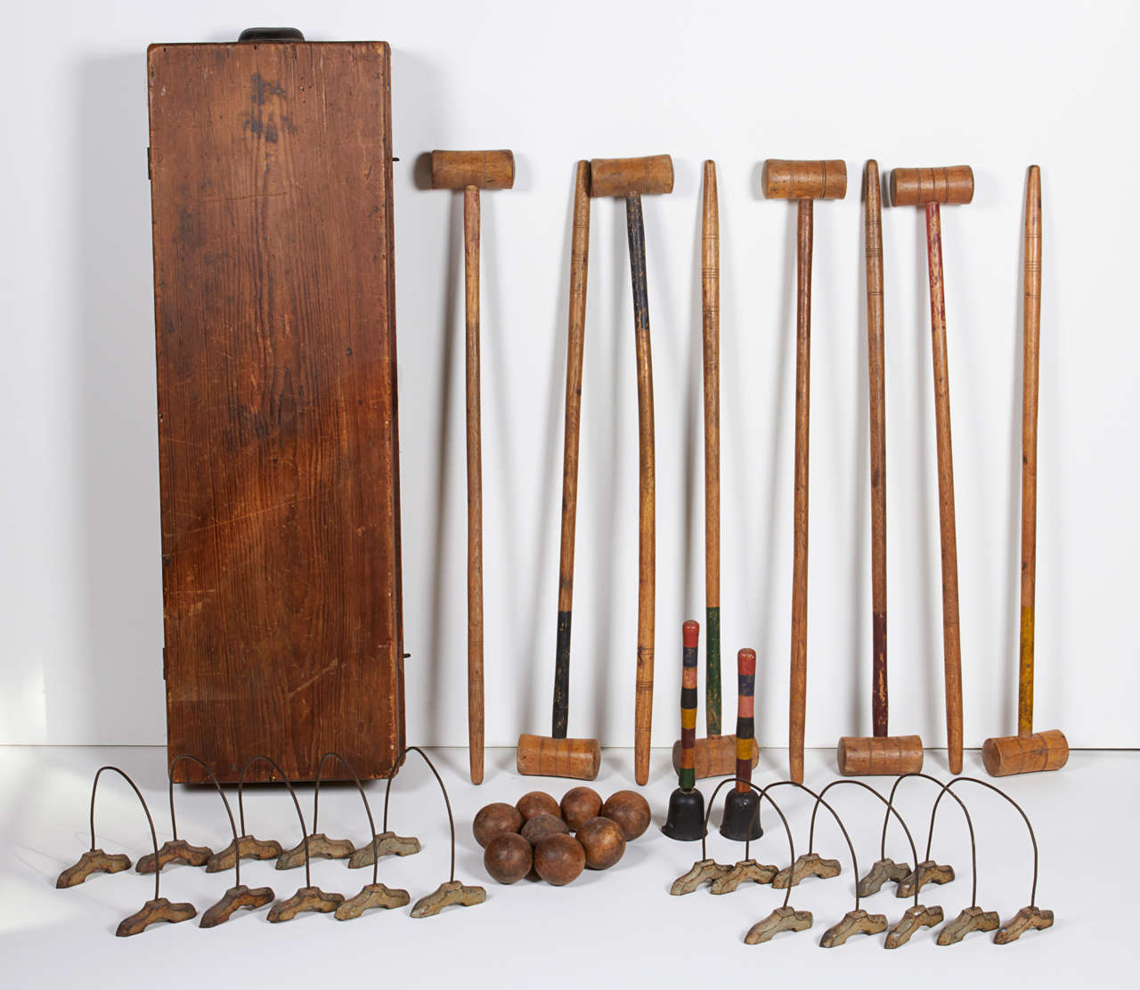Late 19th century, indoor croquet set with case, two 10 inch end posts with cast iron weights, ten- 6