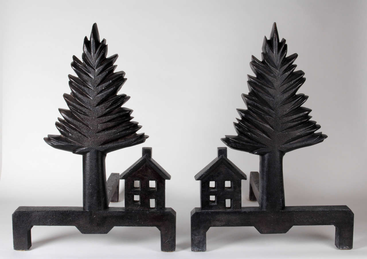 MASSACHUSETTS IRON WORKS Saugus area

Pine Tree and Shaker Style House andirons  circa 1920s

Cast and hand finished iron with a natural black/brown patina.

This pair of extraordinary andirons are a unique expression of American Folk Art at