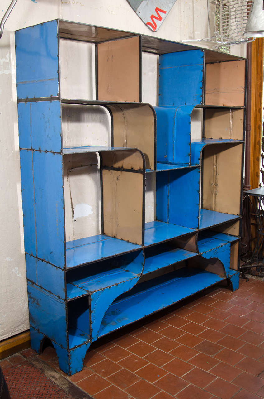 Blue metal étagère made of recycled African oil barrels.