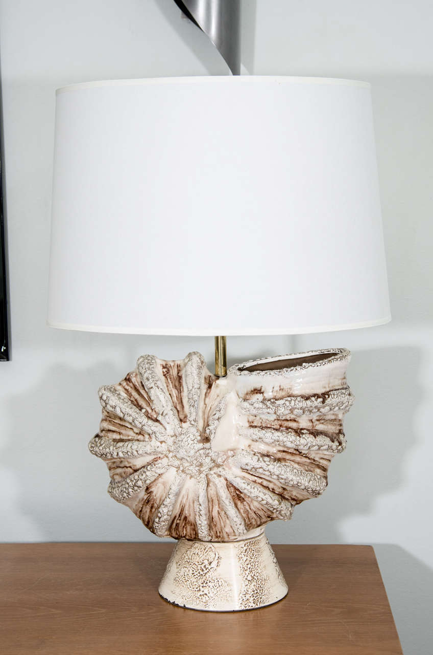 Hand crafted ceramic shell lamp.