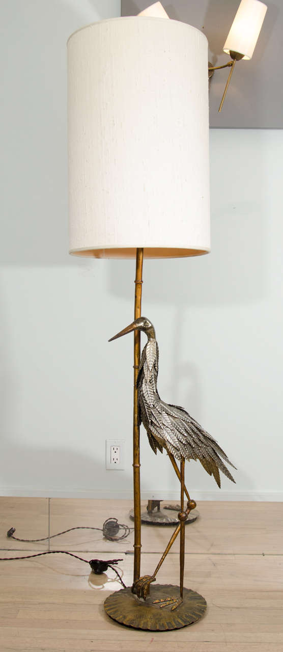 Handmade brass artisanal stork. The feathers are crafted one by one standing on a brass base and bamboo detailed lamp.