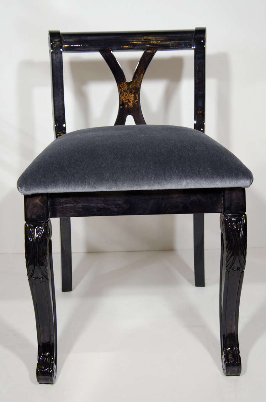 Elegant Art Deco era vanity stool or side chair, in ebonized walnut wood with charcoal gray mohair.  Low back design with cabriole legs with hand-carved details.  Also features beautiful curved cross back with X-form. Two stools available and sold