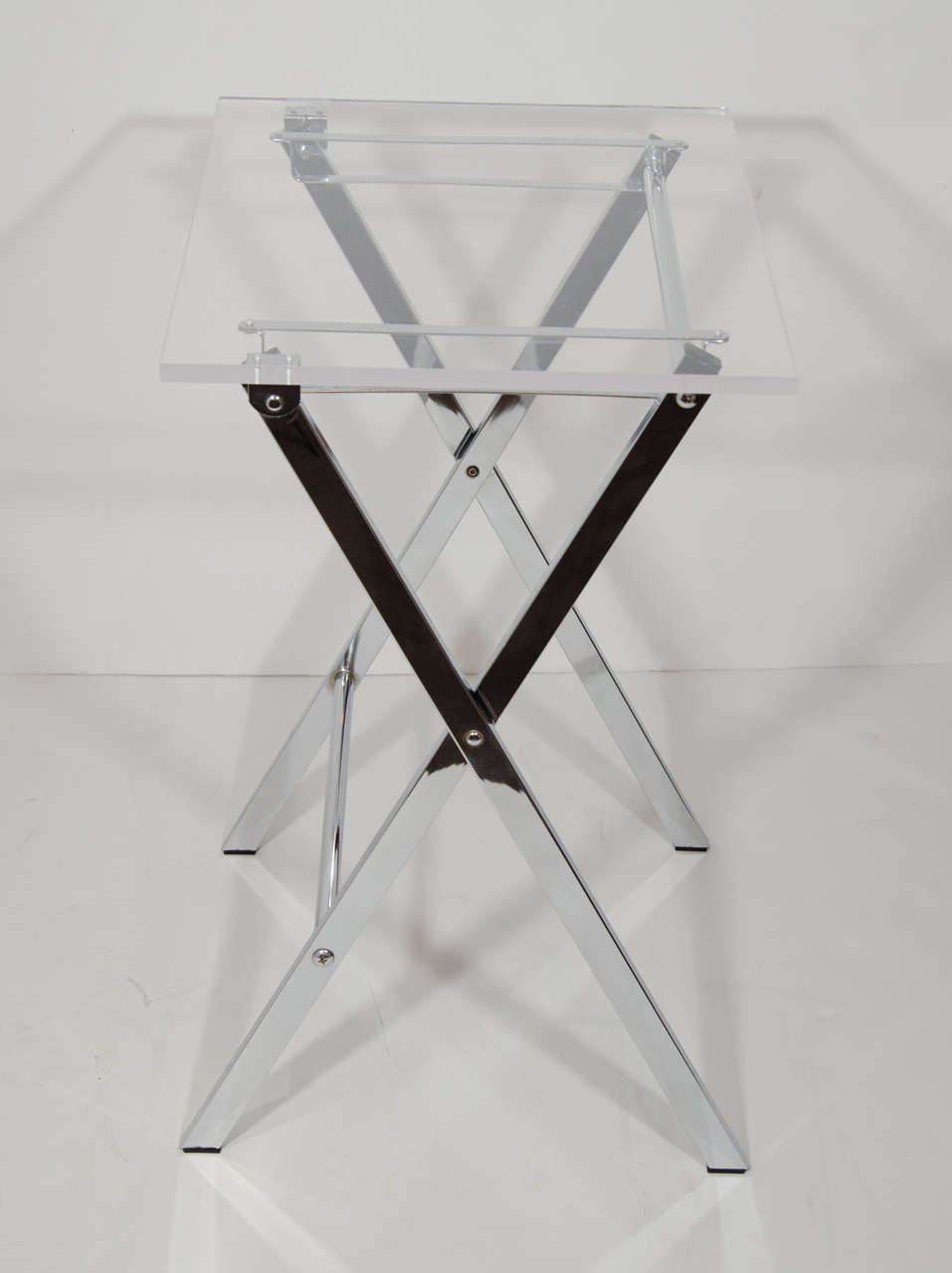 Pair of vintage folding tray tables with modernist design. The tables have 