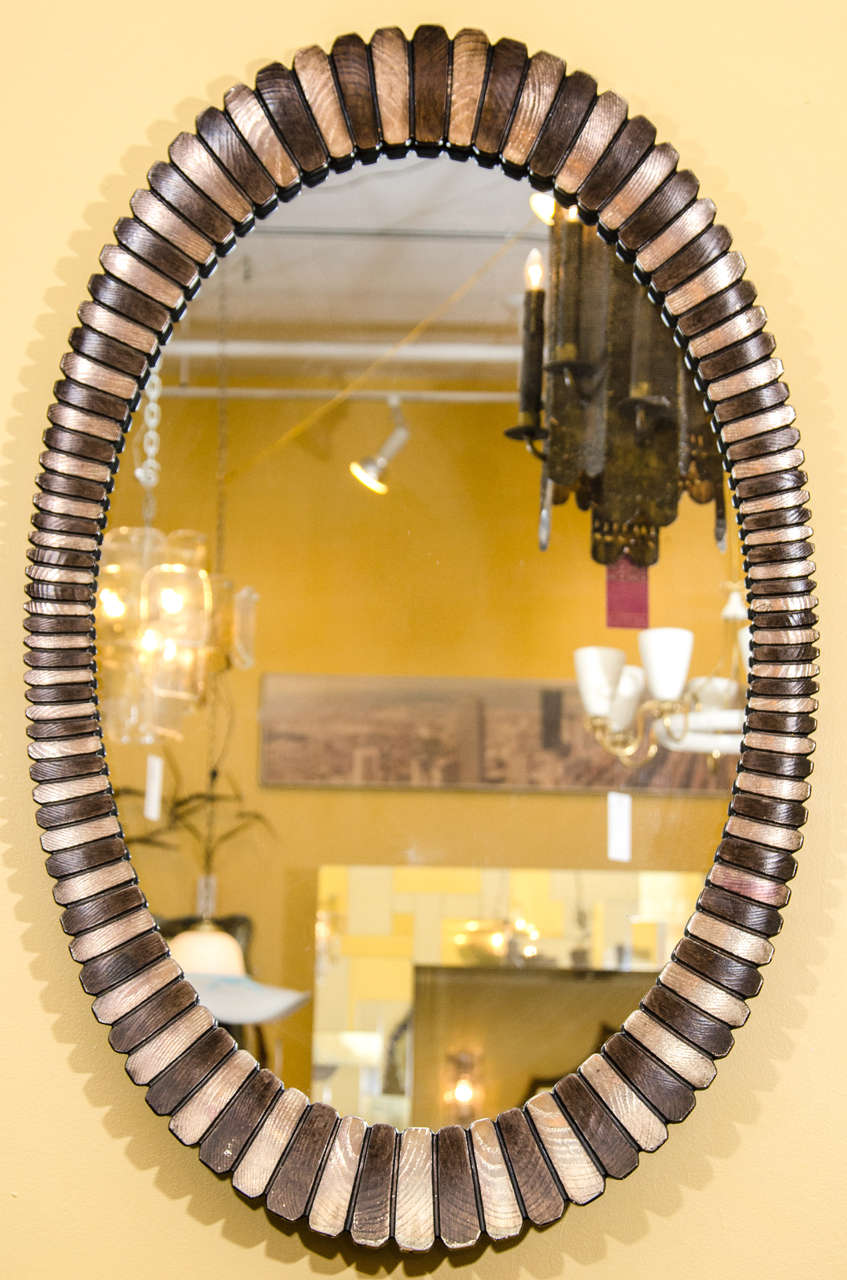 Beautiful decorative modern cast resin oval mirror with gold tone accents. Please contact for location. 