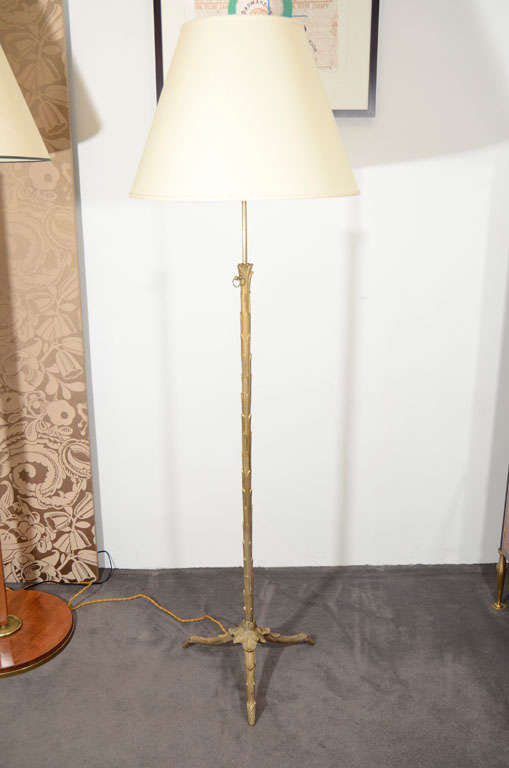 Adjustable height bronze floor lamp by Maison Charles. Stamped on base.

This model is illustrated in L'éclairage dans la Maison, Editions Charles Massin, Paris, p. 50. and on p. 59 of the Catalogue E. A. Charles & Fils.