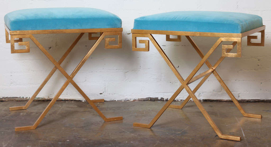 Greek key stools with gold leaf finish and blue velvet cushions.